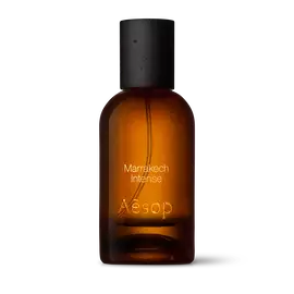 Amber glass Aesop Marrakech Intense Eau de Parfum bottle with black cap on a white background.